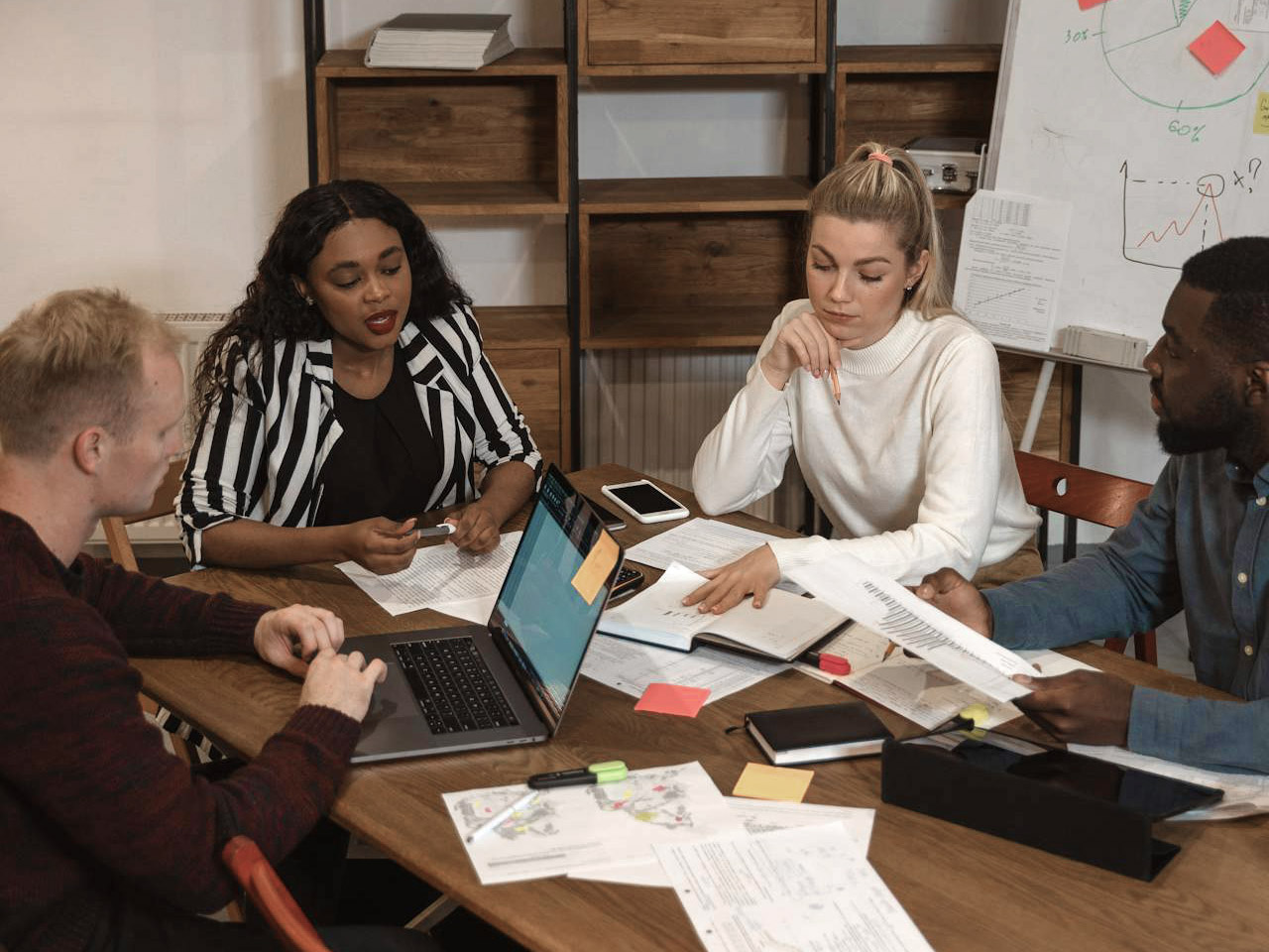 Business team reviewing strategic design plans on a conference table